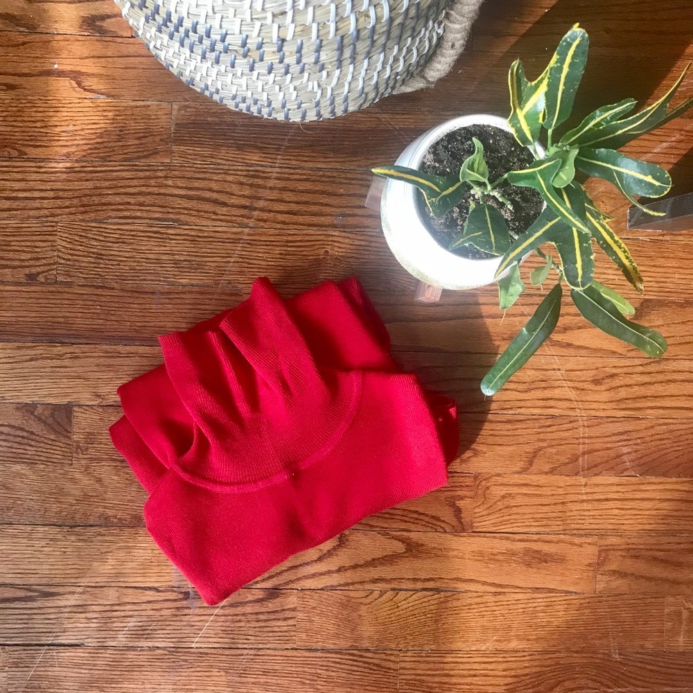Bright red turtleneck sweater